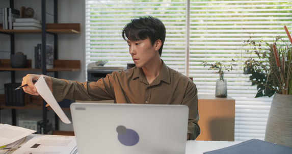 Korean Computer Talented South Korean Architect Using Laptop Computer At A Cozy Modern ...