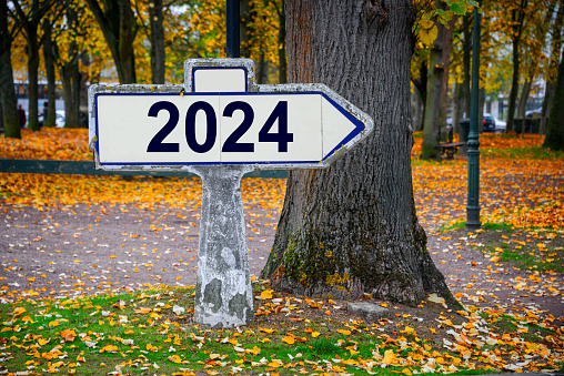 2024 written on an old french roadsign, fall background new year greeting card