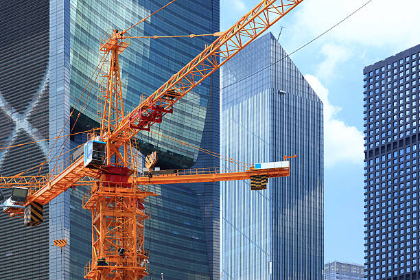 Skyscrapers and construction site in guangzhou China Guangzhou crane machinery stock pictures, royalty-free photos & images