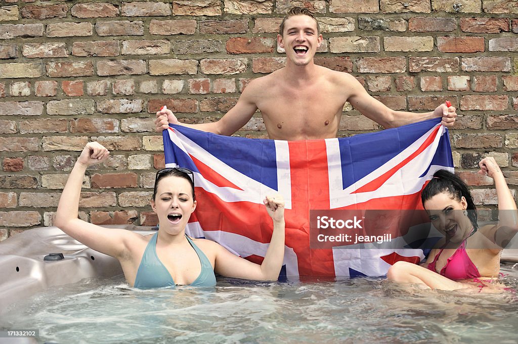 Happy UK supporters in hot tub Happy UK supporters in hot tubMore like this One Piece Swimsuit Stock Photo