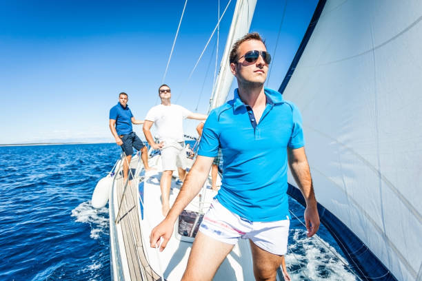 istock Caucasian man standing on the sailboat looking forward 171332836