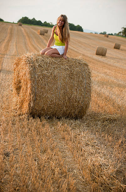 istock Young woman sitting on bale 171332871