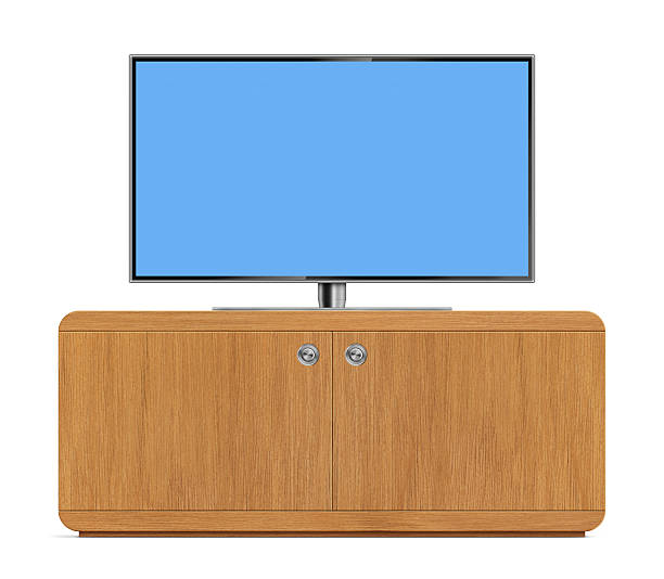 Front view of high-definition flat screen LCD television on a wooden cabinet. TV has a metallic frame and stand with blank blue screen. Clean image and isolated on white background.