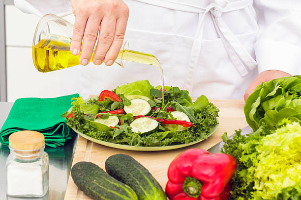 istock Pouring olive oil on salad 171333156