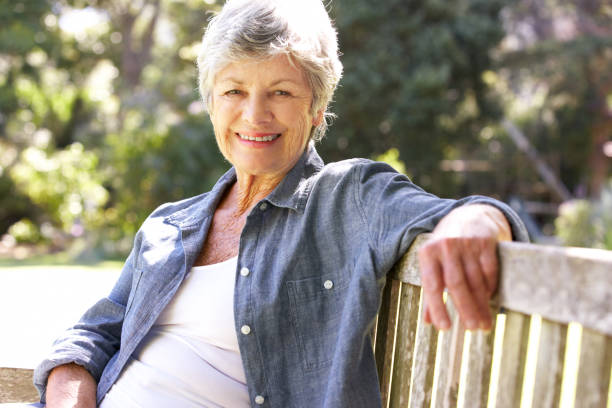 istock Senior Woman Relaxing On Park Bench 171333485