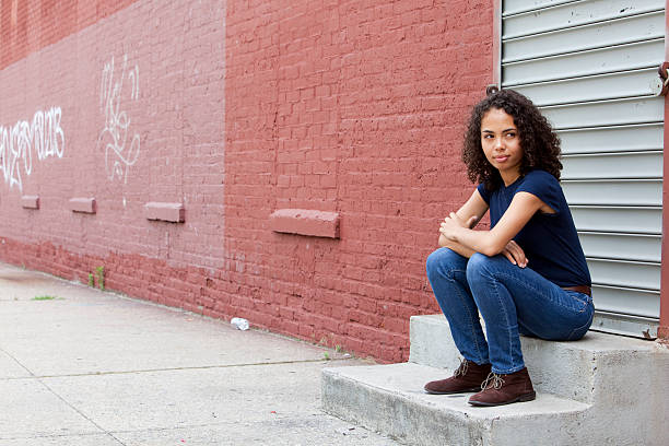 istock Beautiful girl sitting on concrete steps 171333622