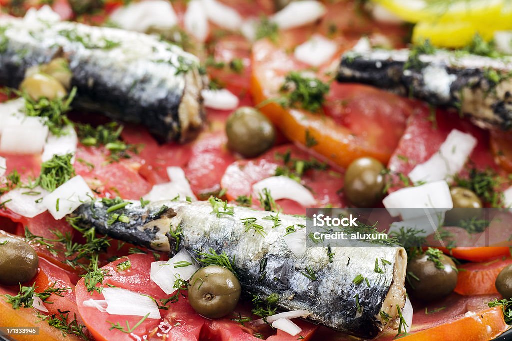 Fish salad Fish salad with tomatoes sardines olives and onions Bluefish Stock Photo