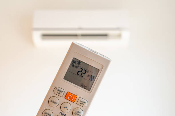istock remote control command for air conditioning to be handled point to the device with the order to 22C° 1713340507