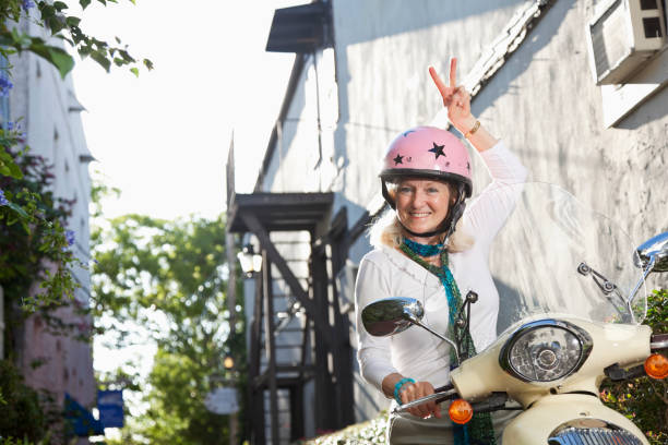 istock Senior woman on motor scooter 171334065