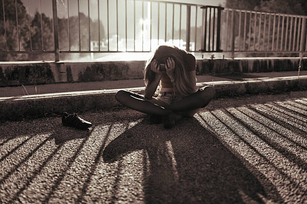 istock Young depressed woman sitting on the bridge 171334230
