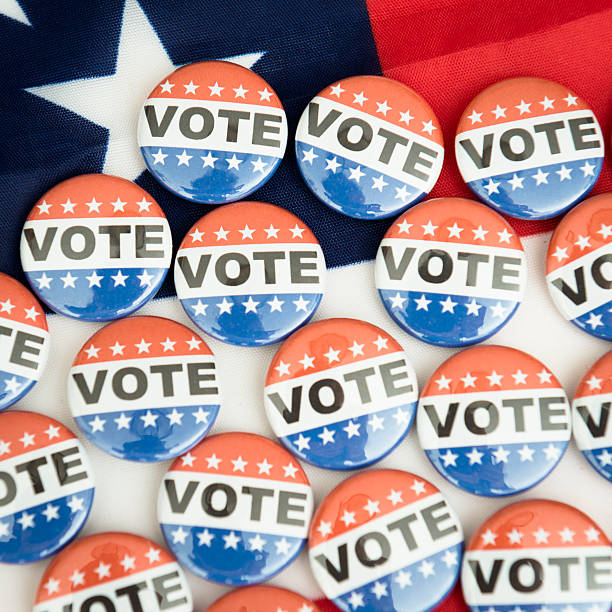istock Vote button for the 2012 Election under us flag 171334394