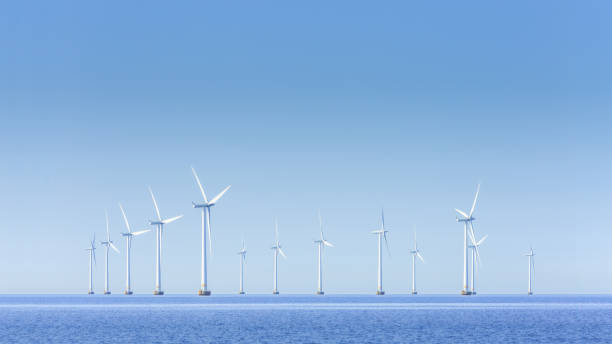 istock Offshore Wind Turbines Farm panorama. 1713347405