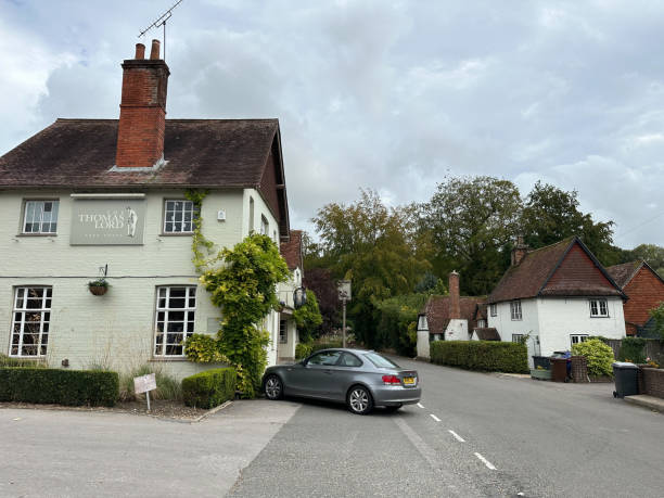 Thomas Lord Pub in West Meon village street view in Hampshire, England, UK Thomas Lord Pub in West Meon village street view in Hampshire, England, UK petersfield stock pictures, royalty-free photos & images