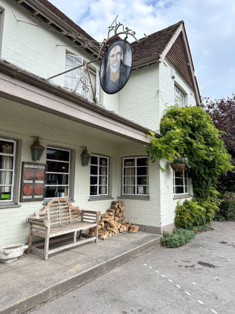 Thomas Lord Pub in West Meon village street view in Hampshire, England, UK Thomas Lord Pub in West Meon village street view in Hampshire, England, UK petersfield stock pictures, royalty-free photos & images