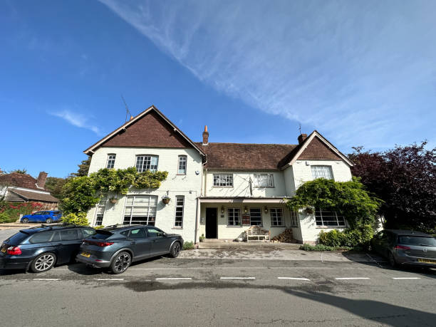 Thomas Lord Pub in West Meon village street view in Hampshire, England, UK Thomas Lord Pub in West Meon village street view in Hampshire, England, UK petersfield stock pictures, royalty-free photos & images