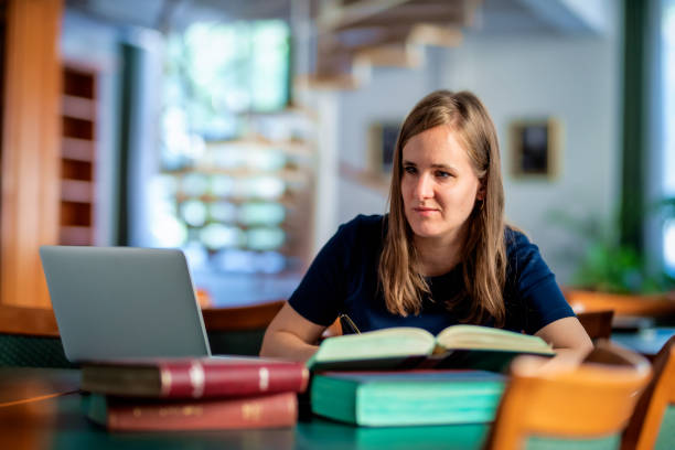 istock A visually impaired young woman sitting and studying in the university library 1713348323