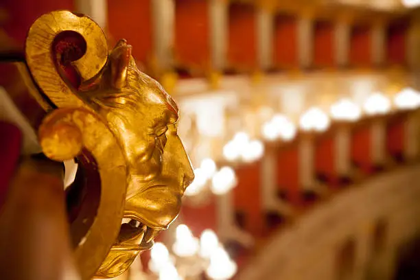 Golden wood lion, etail of boxes of Baroque Italian Theater in Reggio Emilia (first opening the April 21, 1857). Horizontal shot.