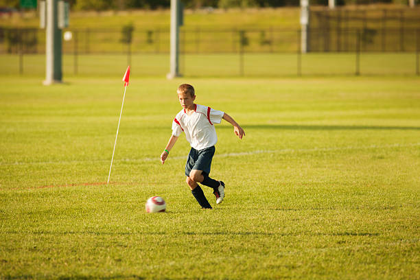 istock Young Soccer Player with Ball on Field 171335265