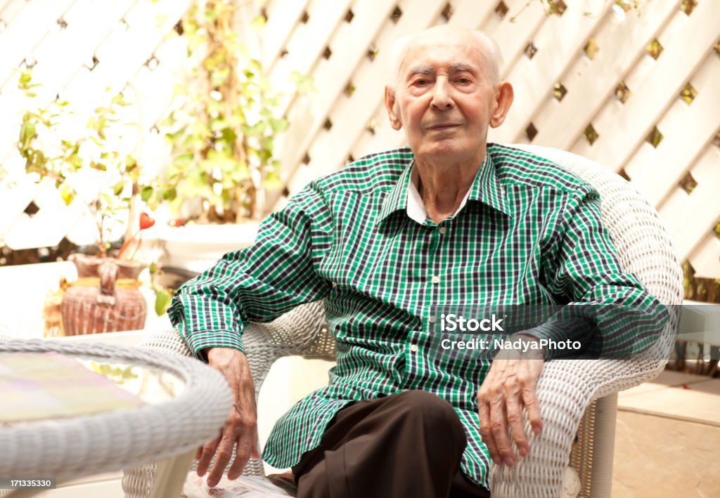 Old Man 96 years old man sitting in his garden. Over 100 Stock Photo