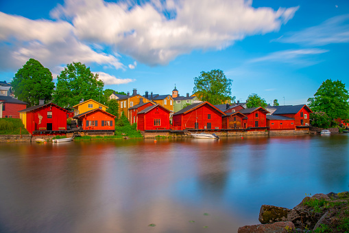 Classical view of the city of Porvoo, the second-oldest city of Finland. The old church is in the background and red wooden houses in the foreground.