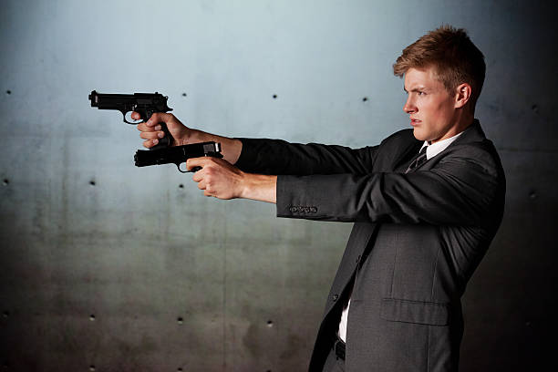 istock Security businessman aiming with handguns 171335875