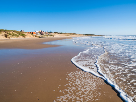 Beach at Punta del Diablo in Uruguay, a popular destination for backpackers and surfers in the country