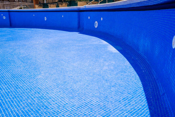 istock Cleaning an empty swimming pool in a residential 1713364544