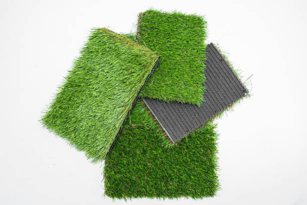 istock Sample pieces of green artificial grass of different thickness. 1713364622