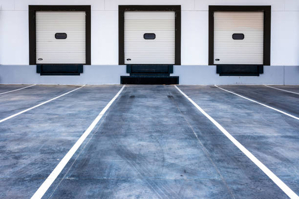 istock Loading bays for trucks in a modern merchandise shipping company. 1713364789