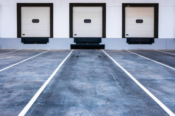 istock Loading bays for trucks in a modern merchandise shipping company. 1713364875