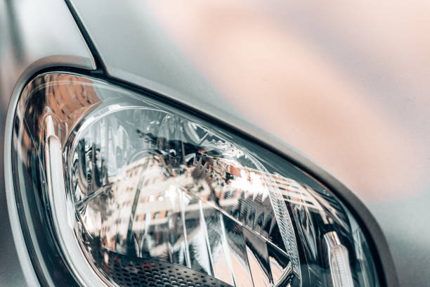 istock Headlights of a generic car without daylight, with plastic glass. 1713365313