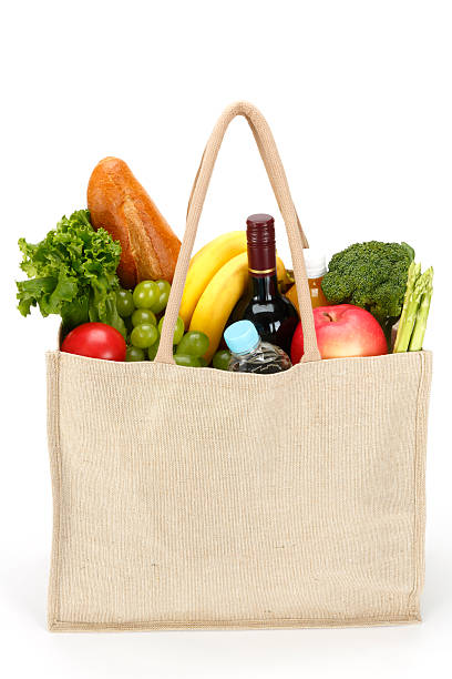 eco friendly shopping bag - tomato apple green isolated stock-fotos und bilder