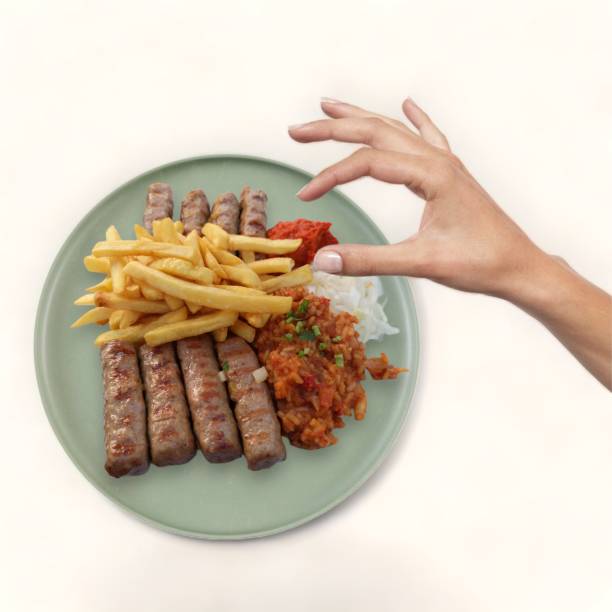 istock Female hand takes the chips from the plate- 1713373448