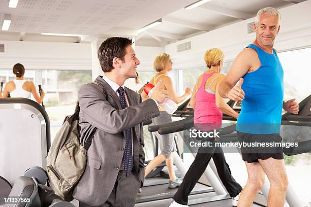 Businessman Arriving At Gym After Work Stock Photo - Download Image Now - Gym, Health Club, Arrival