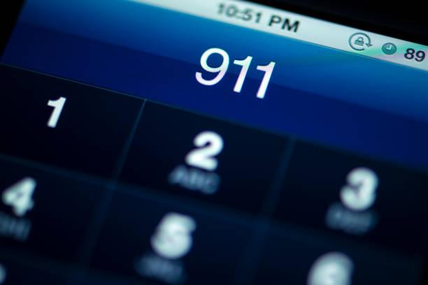 Smartphone Call to 911 Calling 911 from smart phone emergency services occupation stock pictures, royalty-free photos & images