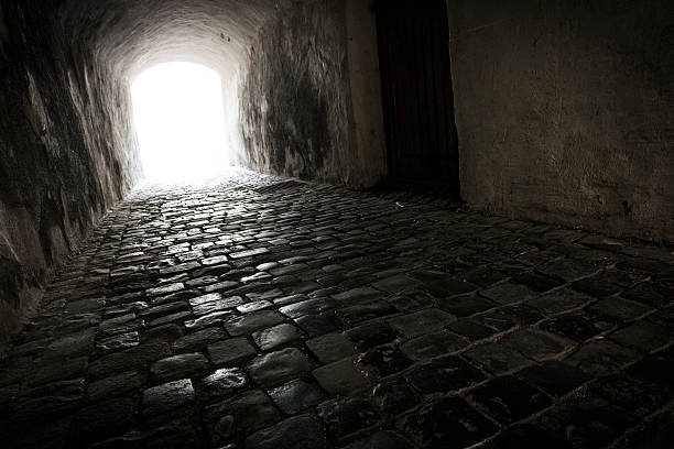 dark tunnel with white light at the end