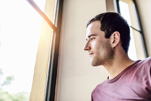istock Man looking out of the Window 171338271