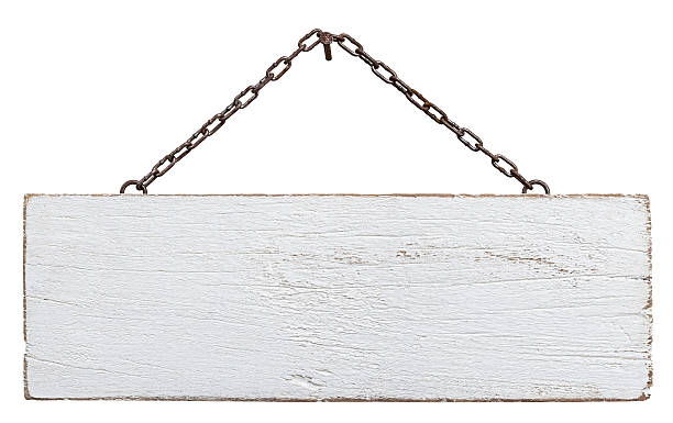 Old weathered white wood signboard. Old weathered white wood signboard, hanging by an old chain from a nail, composite image, isolated on white, clipping path included. rusted chain stock pictures, royalty-free photos & images