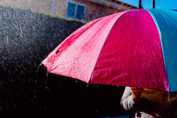 istock Colorful umbrella wet by heavy rain. 1713384312