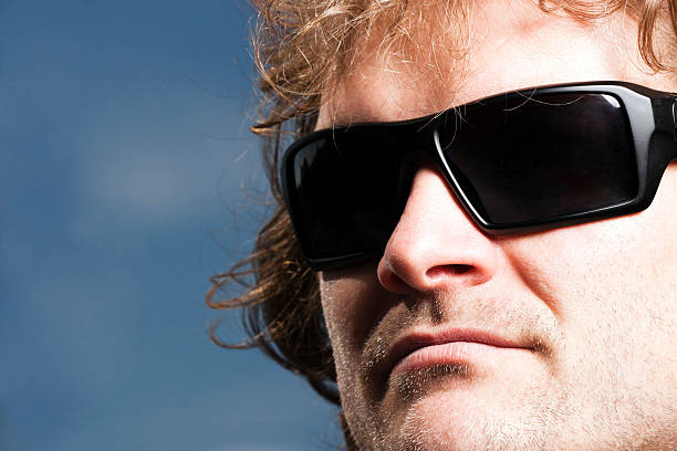 istock Face of young man with sungasses, dark sky, copy space 171338570