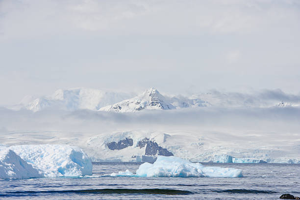 Antarctica "Antarctica landscape, view at Lemaire channelMore pictures from Antarctica:" iceberg dramatic sky wintry landscape mountain stock pictures, royalty-free photos & images