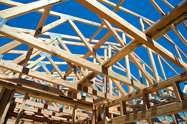 House Framing Looking up through the frame of a new house. To see more images click on the link below : roof beam stock pictures, royalty-free photos & images