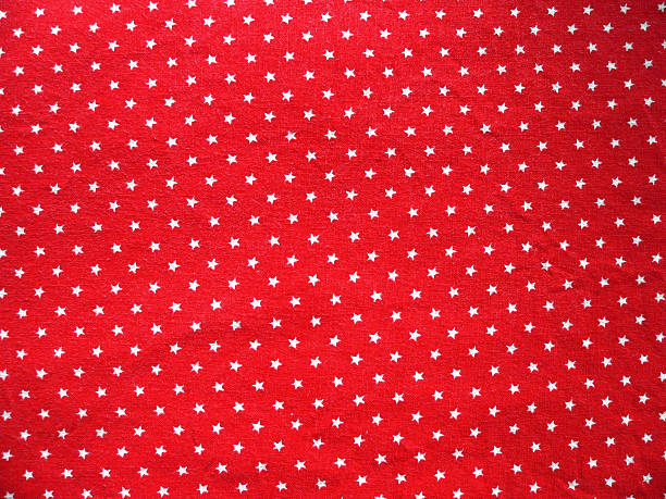 Texture 2 - Red cotton fabric with white small stars stock photo