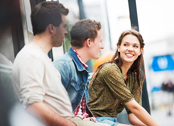 istock Three young teenagers waiting at the bus stop. 171339385