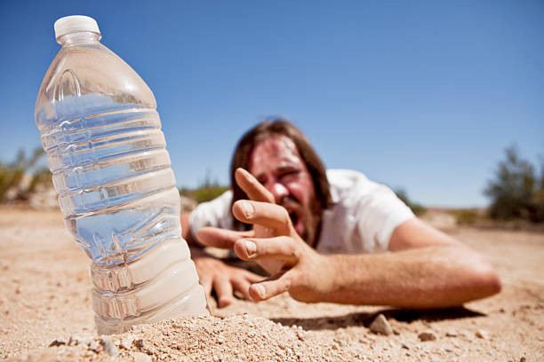 istock Man in Desert Reaching for Water 171339497