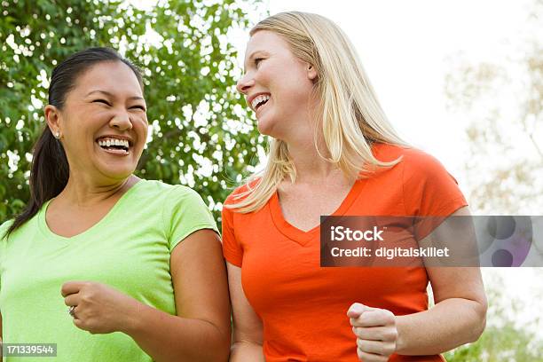 Woman Walking And Talking Stock Photo - Download Image Now - Walking, Exercising, Women