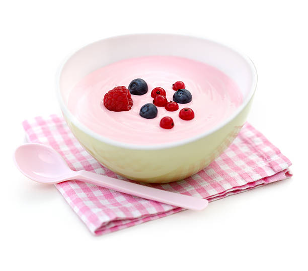 istock A pink yoghurt with berries with a pink tea towel and spoon 171339785