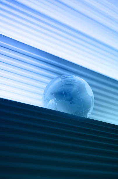 istock cool blue globe among curtain slits 171339963