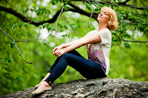 Woman Enjoying summer in park