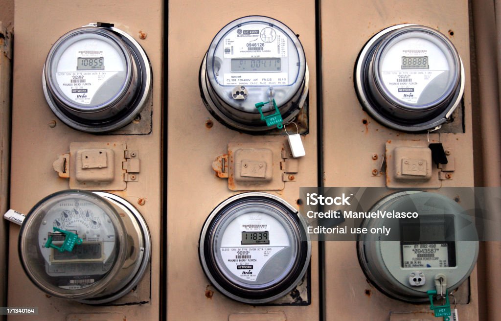 meters "Clearwater, Florida, USA - July 18 2007: Different electricity meters in the back of an office building." American Culture Stock Photo